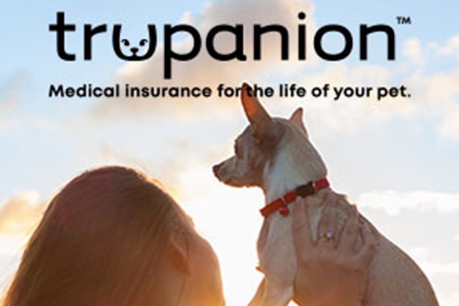 Pet Insurance - Woman Holding Up Dog with Trupanion Medical Insurance for the Life of Your Pet Text on Top of Image